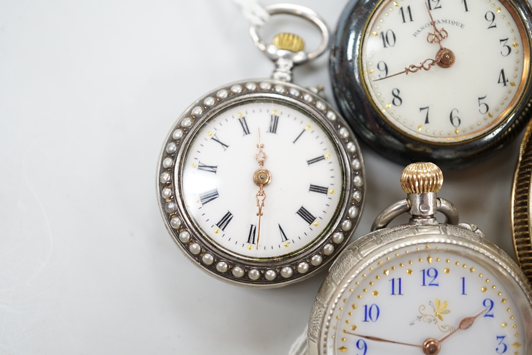 A gold plated open face pocket watch, a silver wrist watch, three fob watches including Art Nouveau 935 and enamelled and a globe watch.